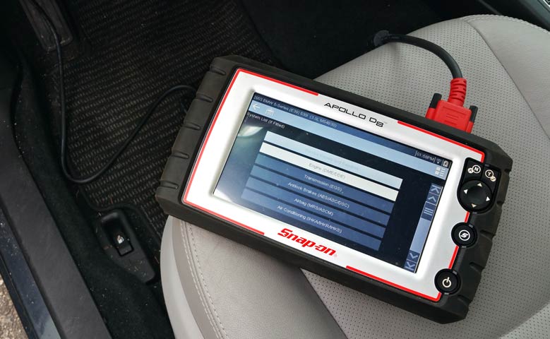 Snap On automotive computer code analysis tool lying on the driver's seat